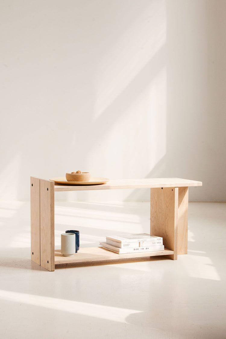 Wooden bench with minimal decor on a white background