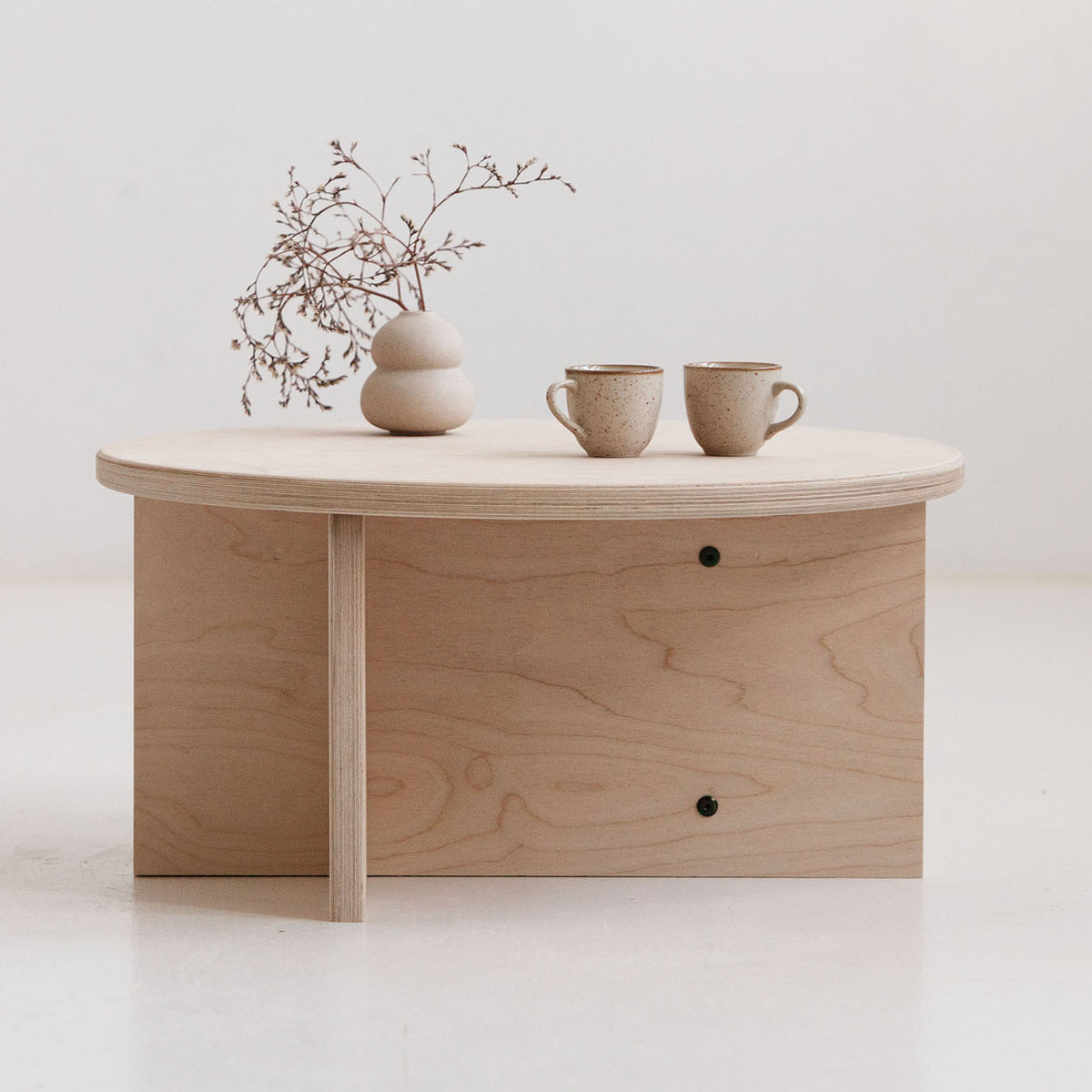 Minimalist Japandi style coffee table USA with round top and storage shelf