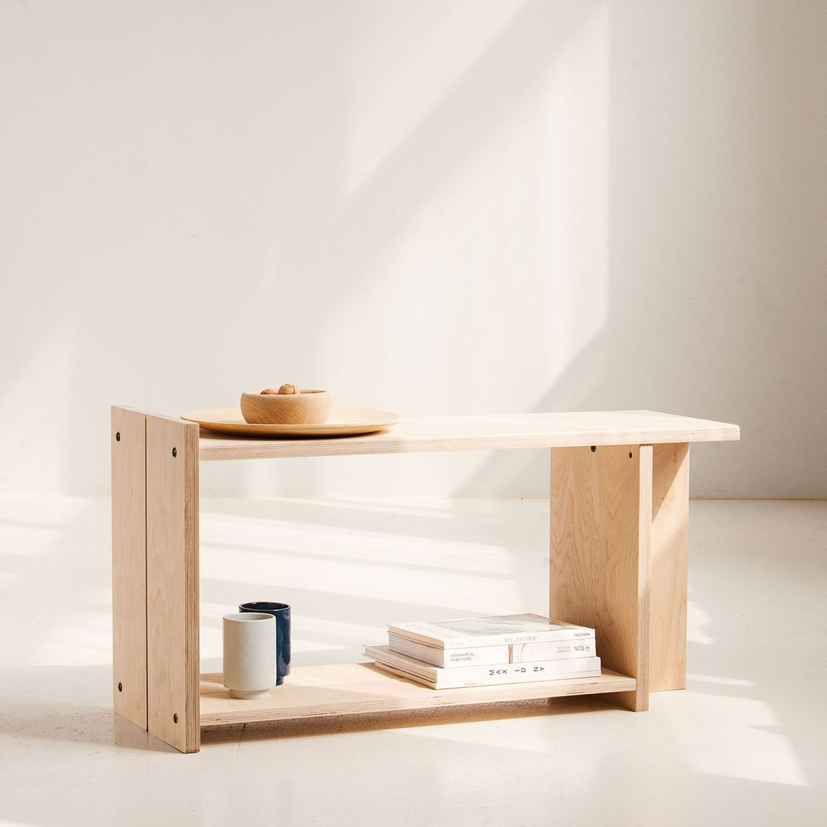 Wooden bench with minimal decor on a white background