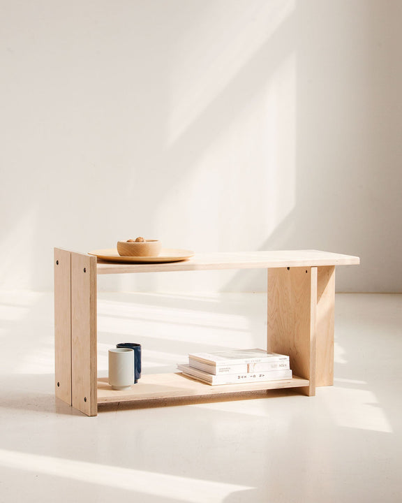 Wooden bench with minimal decor on a white background