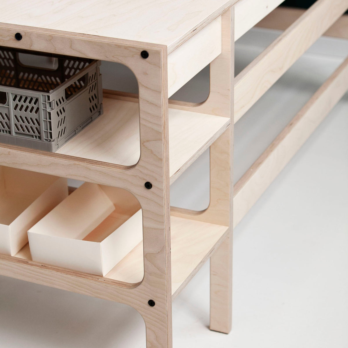 Back-of-Mid-century-modern-corner-desk-with-drawers-and-shelves-in-natural-wood-stain