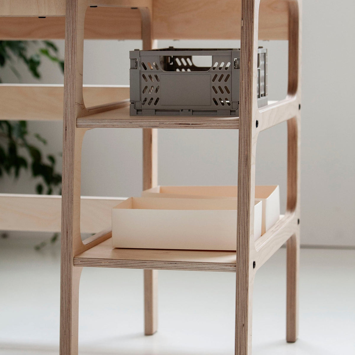 Detail-of-Mid-century-modern-corner-desk-with-drawers-and-shelves-in-natural-wood-stain