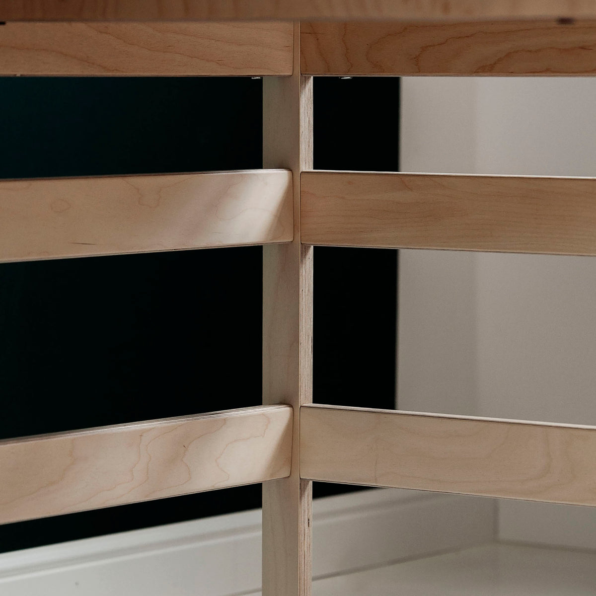 Detail-of-Mid-century-modern-corner-desk-with-drawers-and-shelves-in-natural-wood-stain
